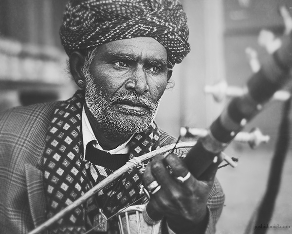 Black and white portrait of a Ravanahatha player from Jaisalmer, Rajasthan