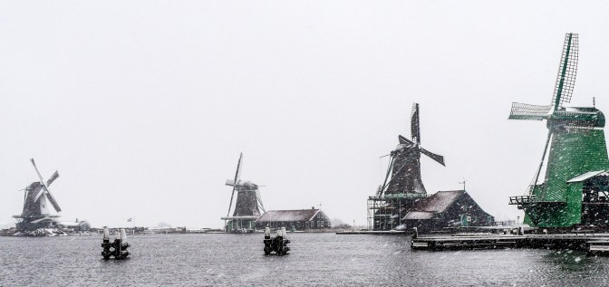 Winter landscape with windmills and snow at Zaanse Schans