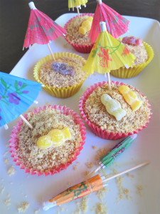 Salted caramel and jelly baby sunbathers beach cupcakes uk recipe with cocktail umbrellas