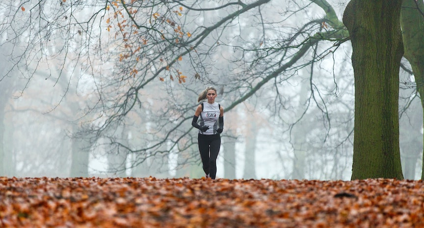Woman running on a foggy day